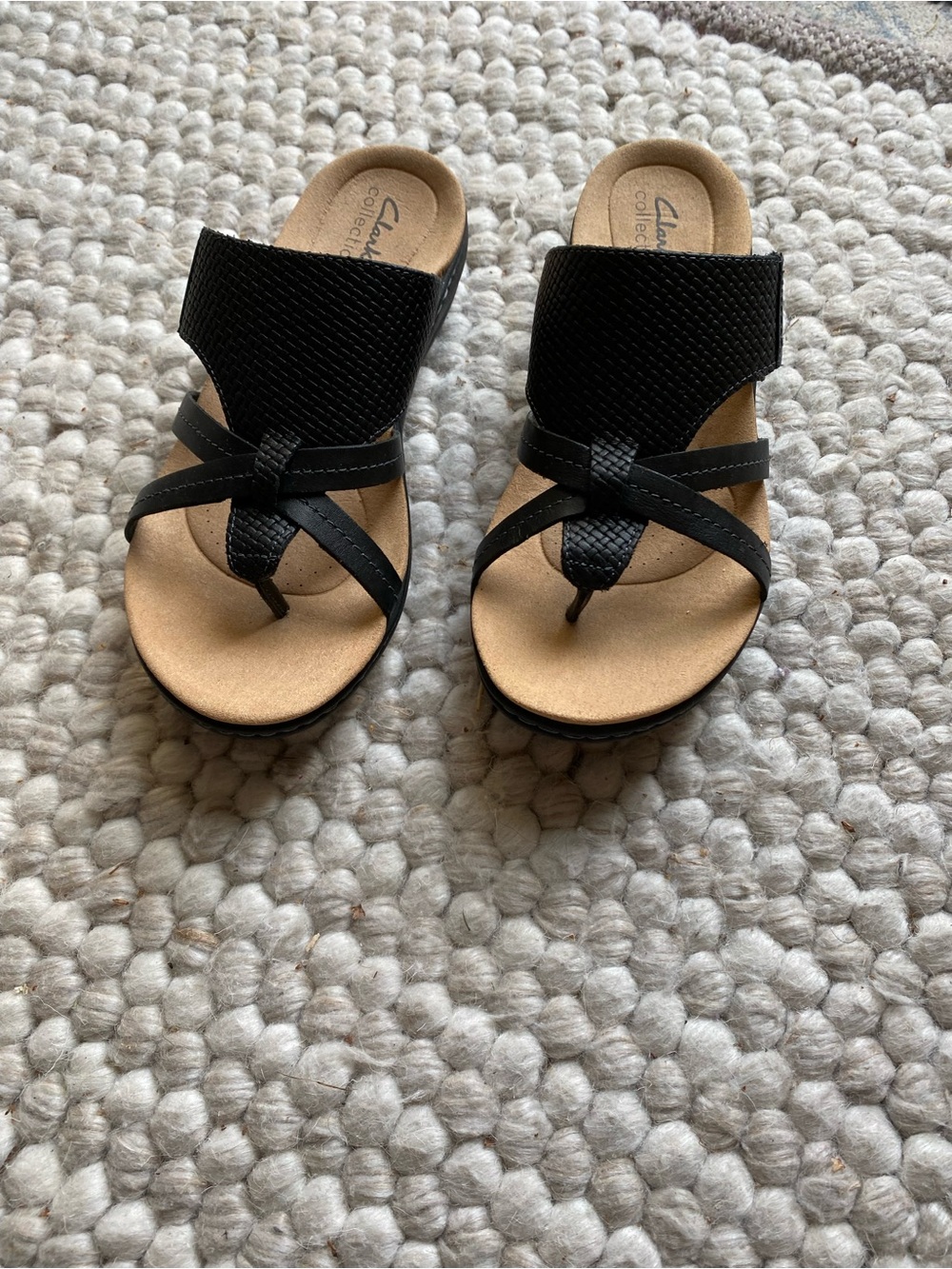 Clarks Women’s Black and Tan Slide Sandals